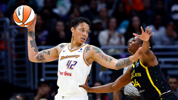 Brittney Griner controls the ball against Joyner Holmes